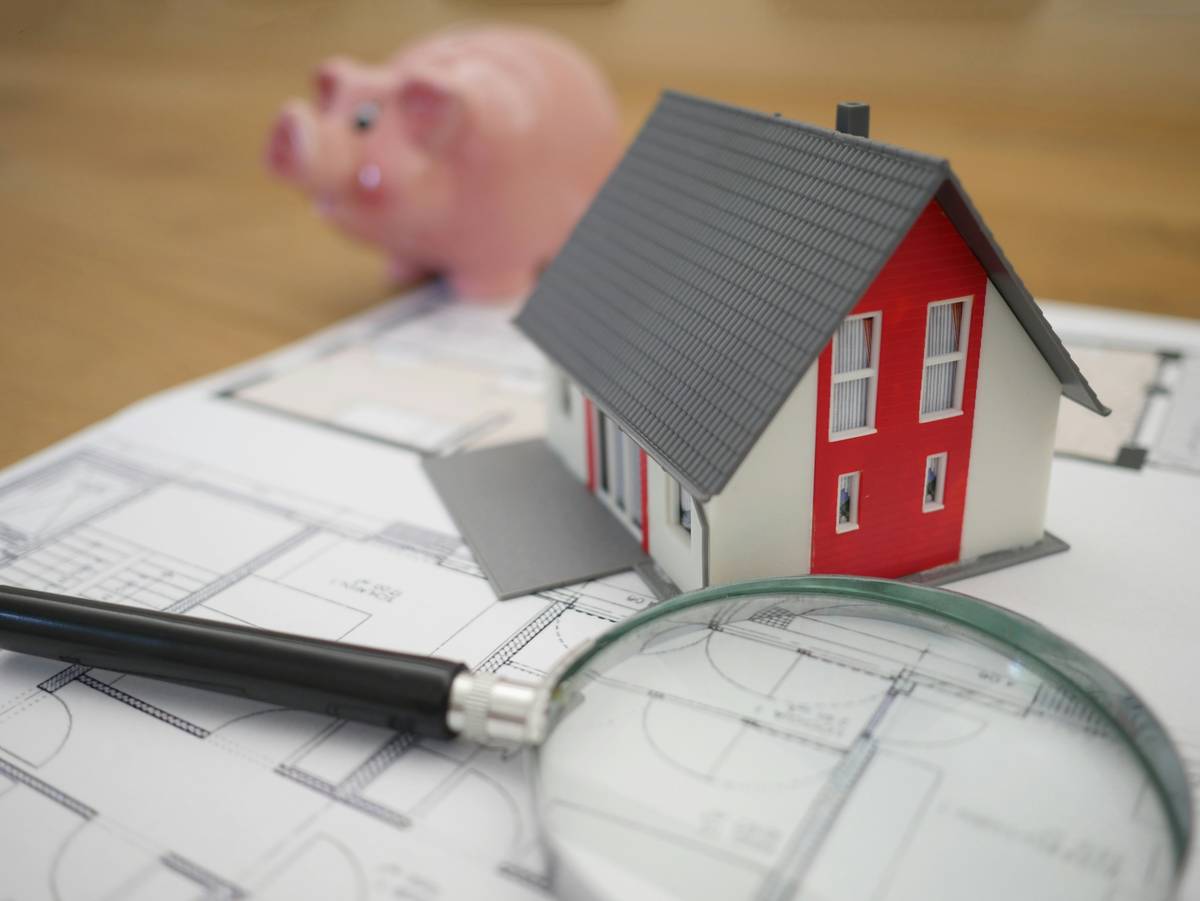 Contractor Selection Tips: homeowner reviewing license documents with repair professional after vandalism incident
